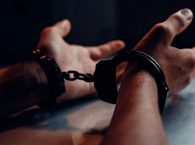 handcuffed person